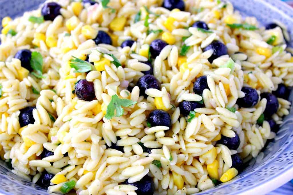Orzo Pasta Salad with Sweet Corn and Blueberries in a blue bowl.