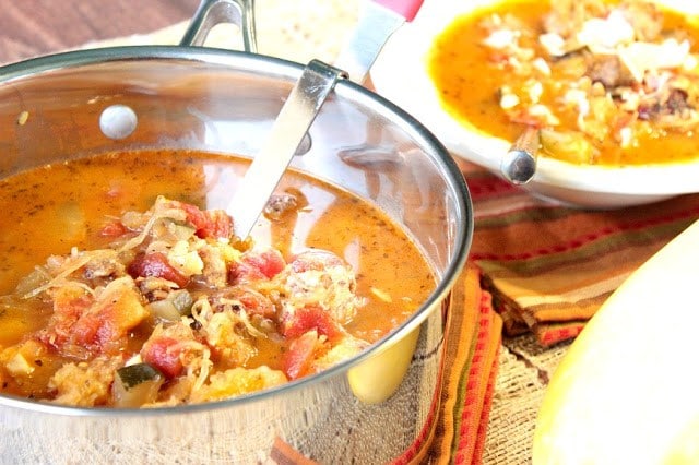  Spaghetti Squash Soup in a pot with a bowl in the background.