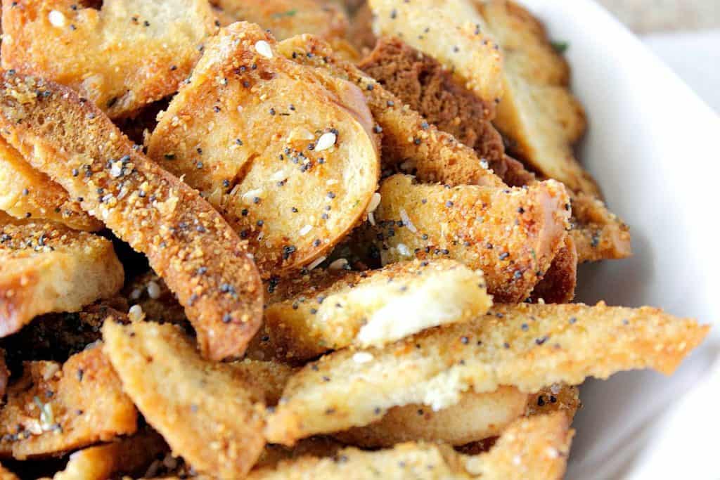 Closeup photo of crunchy everything bagel chips with poppy and sesame seeds.