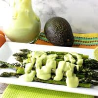 Creamy Avocado Hollandaise Sauce Over Oven Roasted Asparagus