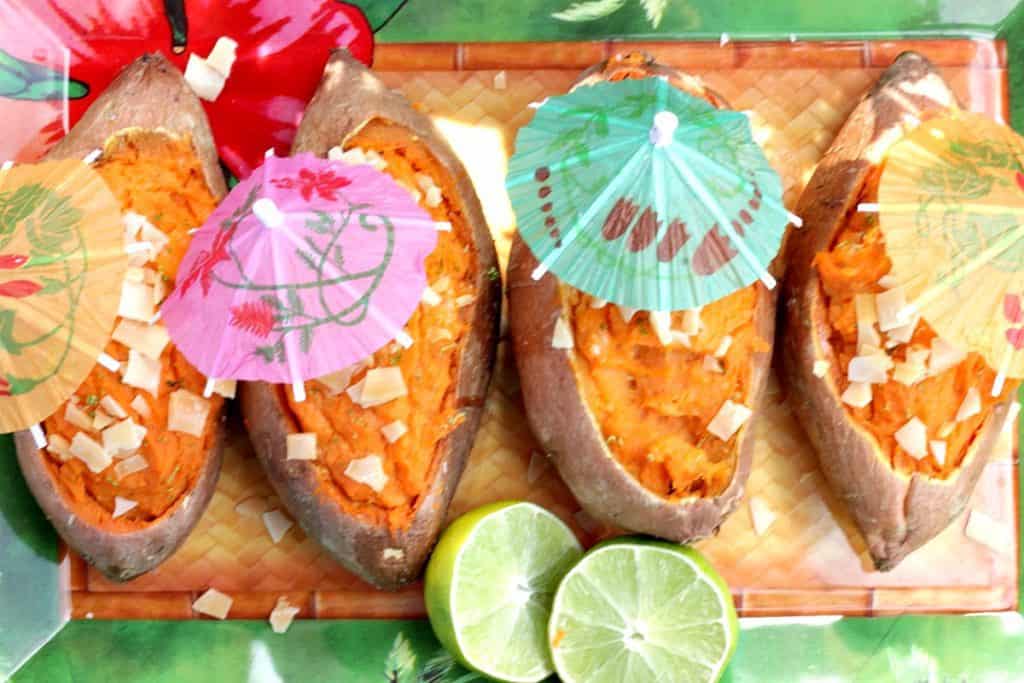 Overhead photo of Twice Baked Sweet Potato Boats with Coconut, Lime and party umbrellas.