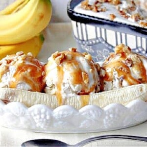 Three scoops of Banana Walnut Ice Cream in a long white dish with a sliced banana.