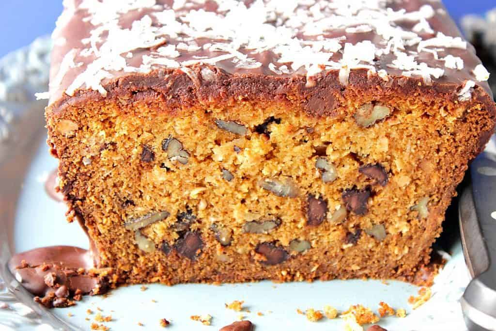 Cut slice of a chocolate chip quick bread with pecan chips and coconuts 