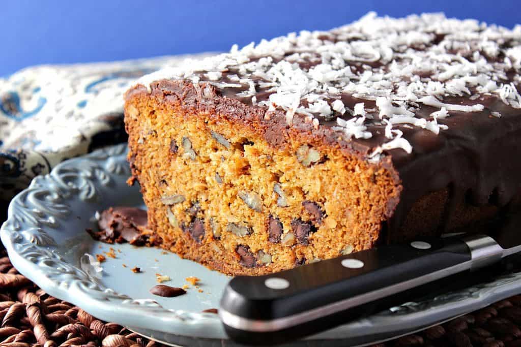 Chocolate Chip Dessert Loaf on a blue plate with a knife. 