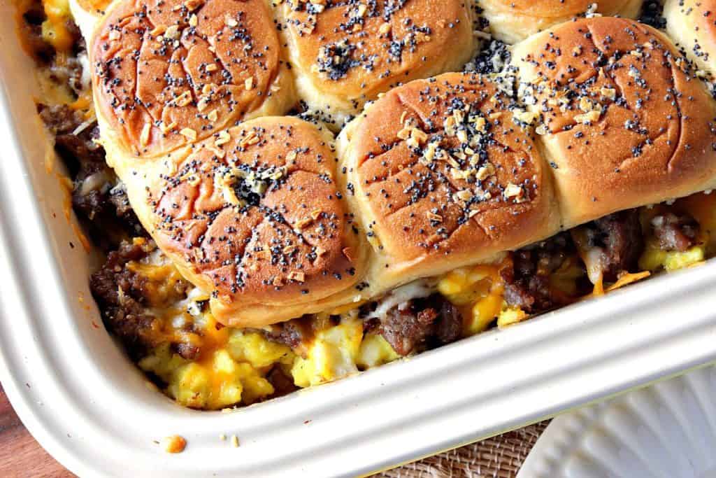 Overhead and closeup image of breakfast sliders with scrambled eggs and sausage 