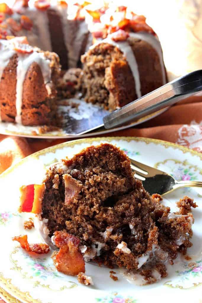 Slice of Bacon Root Beer Bundt Cake on a plate.