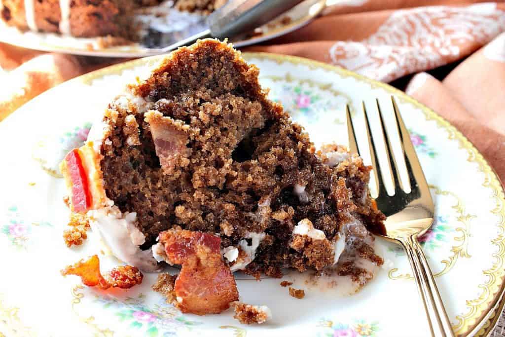 A slice of Bacon Root Beer Bundt Cake on a plate with a fork.