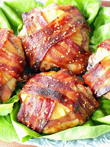 4 Teriyaki Bacon Wrapped Pineapple Chicken Thighs on a plate