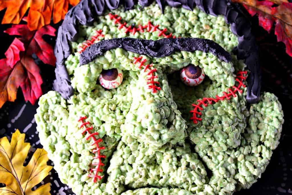 Freaky Frankenstein Rice Krispie Treat with gumball eyes and red stitches