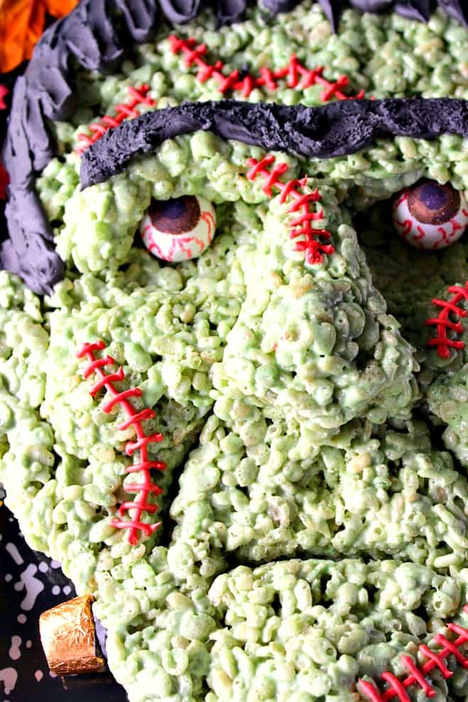 If you're intimidated or scared by the looks of this Frankenstein rice cereal Halloween treat because you think you wouldn't have success making him yourself, I'm here to prove you wrong! - Kudos Kitchen by Renee Frankenstein Rice Cereal Halloween Treat featuring AmeriColor soft gel paste and gourmet writers - Kudos Kitchen by Renee