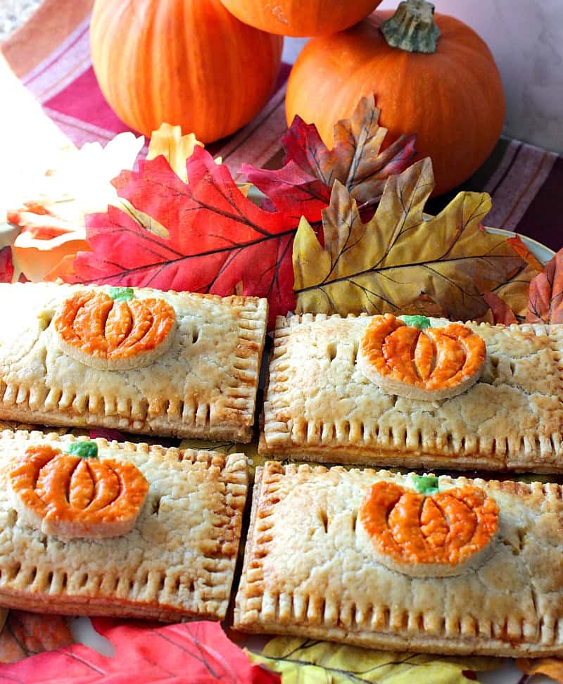 Homemade Pumpkin Hand Pies Embellished with Colorful Pumpkin Crust