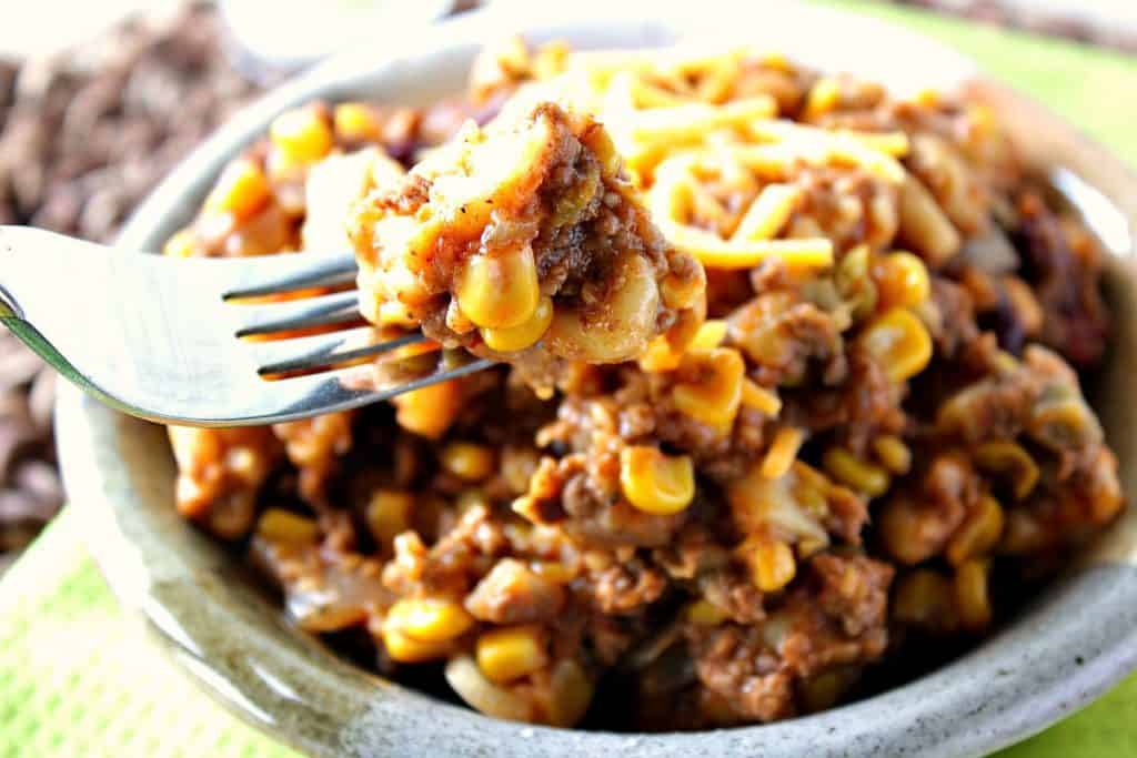 Closeup photo of slow cooker chili mac on a fork.