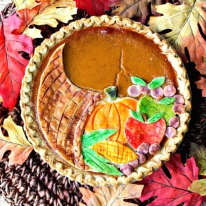 A colorful Cornucopia Pie with a painted crust.