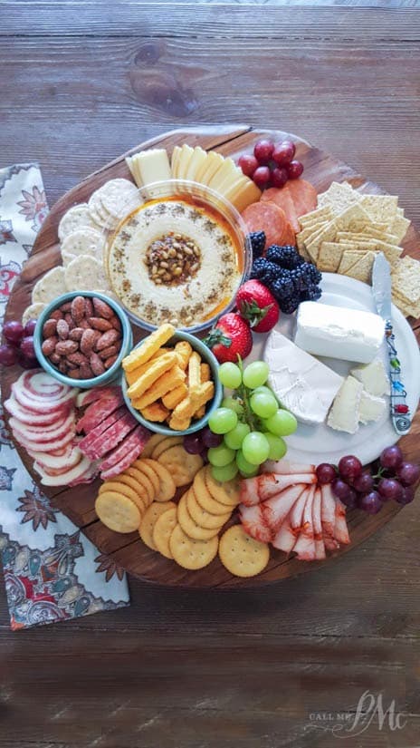 Overhead photo of a meat and cheese platter. New Year's eve appetizers and drinks recipe roundup.