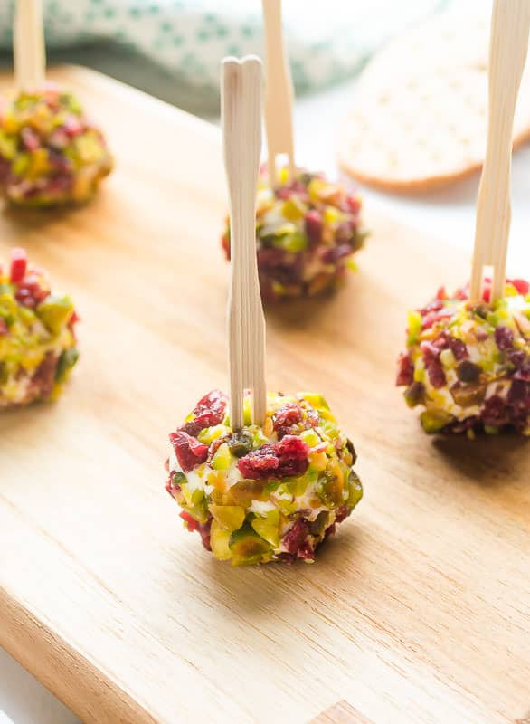 Mini cheese balls on skewers. New Year's eve appetizers and drinks recipe roundup.