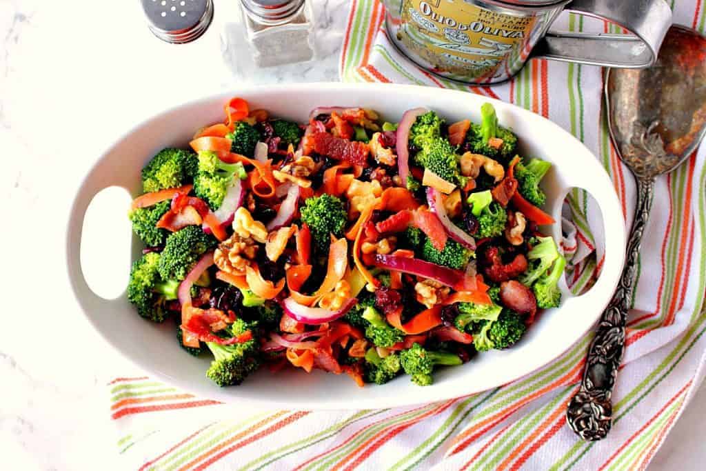 Healthy Broccoli Salad with carrots, walnuts, bacon, cranberries, and red onion. | Kudos Kitchen by Renee