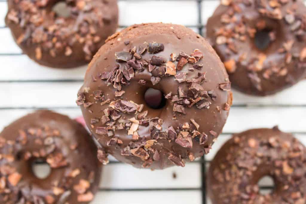 Overhead photo of chocolate donuts for chocolate dessert recipes collection