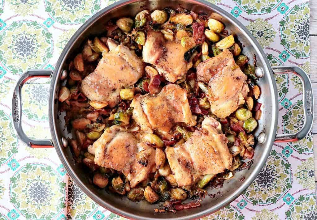 My version of Chef Symon's Skillet Chicken Thighs with Brussels Sprouts & Bacon was delicious! While I won't ever claim my recipe recreation would rival one of an Iron Chef, it was in fact very tasty, and it's one I'll be making again soon... but with one tiny addition. - www.kudoskithenbyrenee.com Skillet Chicken Thighs with Brussels Sprouts & Bacon - www.kudoskitchenbyrenee.com