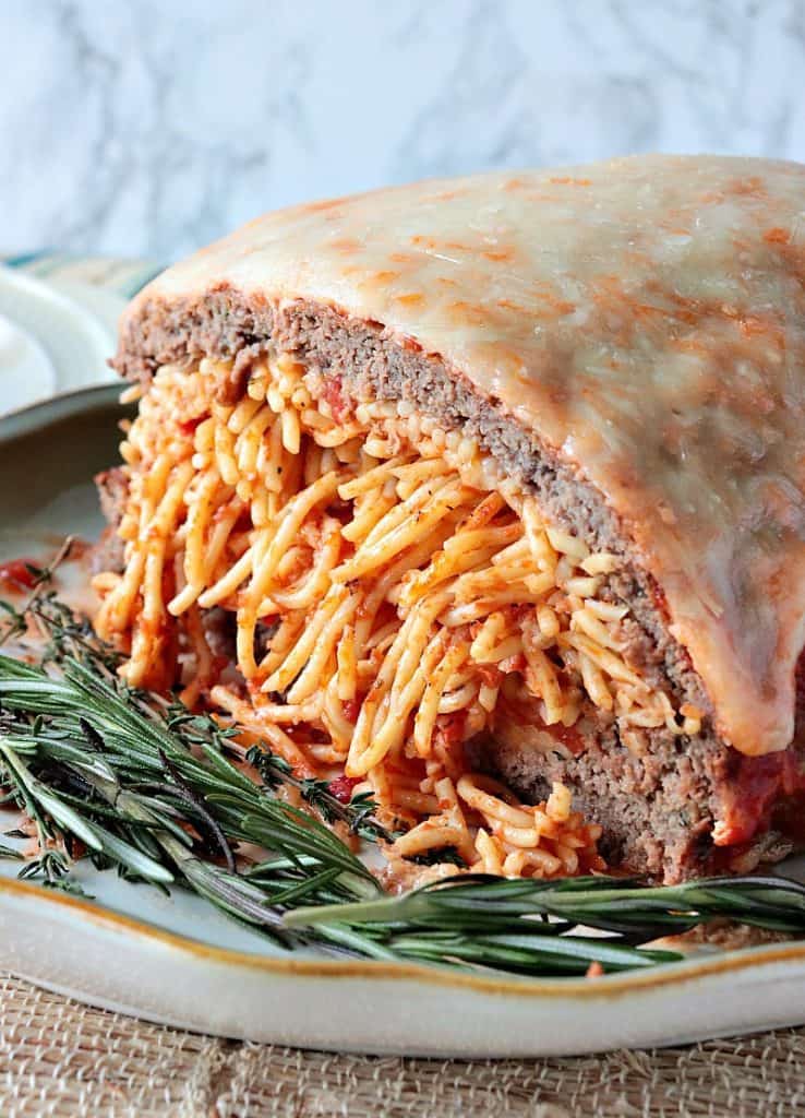 Spaghetti Stuffed Meatloaf with a Melted Cheese Topping - www.kudoskitchenbyrenee.com