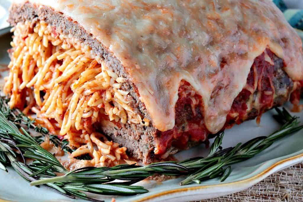 Spaghetti Stuffed Meatloaf with a Melted Cheese Topping - www.kudoskitchenbyrenee.com