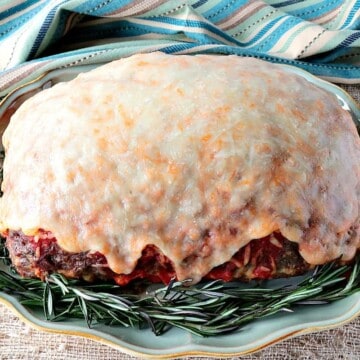 Spaghetti Stuffed Meatloaf with a Melted Cheese Topping - www.kudoskitchenbyrenee.com