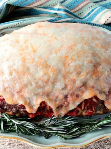 Spaghetti Stuffed Meatloaf with a Melted Cheese Topping - www.kudoskitchenbyrenee.com