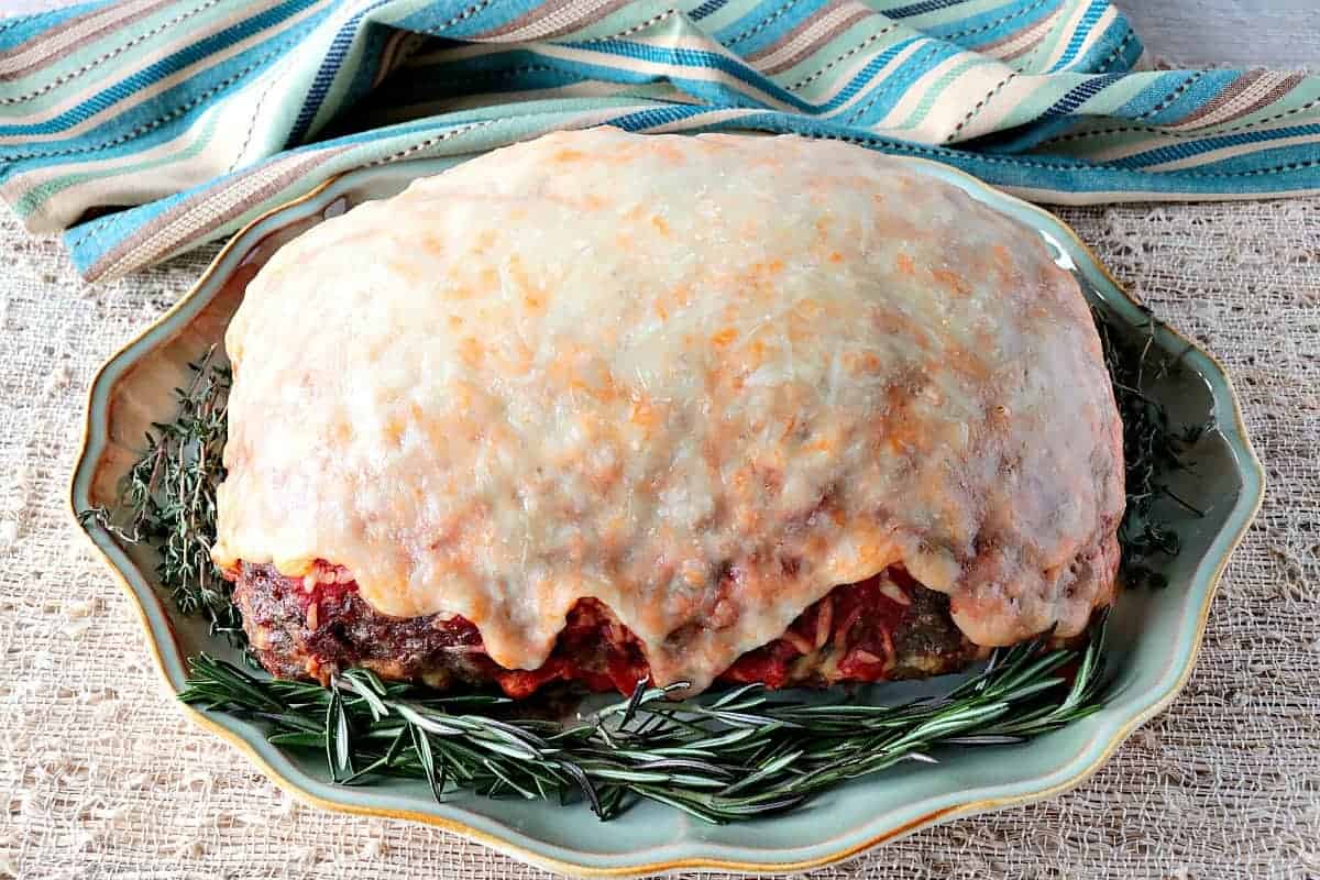 Spaghetti Stuffed Meatloaf with a Melted Cheese Topping - www.kudoskitchenbyrenee.com