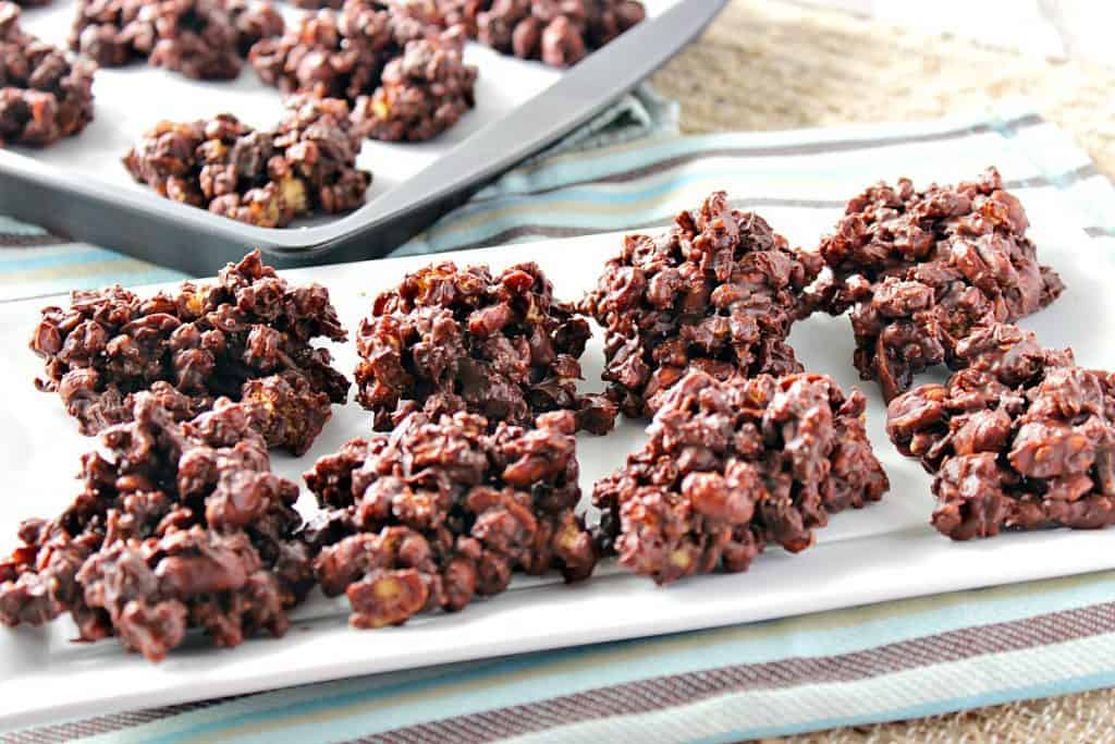 A tray of easy chocolate granola jumbles with a blue and brown napkin. Easy chocolate dessert recipes roundup