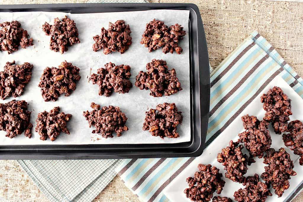 Peanut Butter and Chocolate Granola Jumbles on a baking sheet with parchment paper.