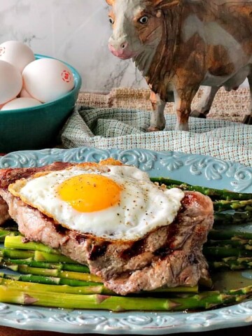 Buttery Rich Steak & Eggs Over Asparagus - www.kudoskitchenbyrenee.com