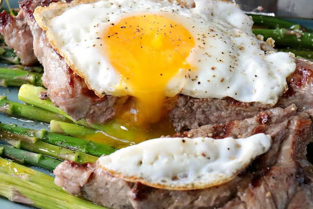Buttery Rich Steak and Eggs Over Asparagus - www.kudoskitchenbyrenee.com