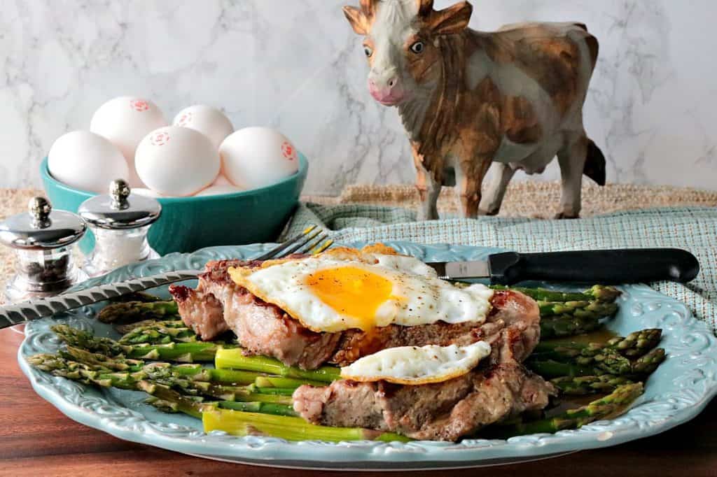 Buttery Rich Keto Steak and Eggs Over Asparagus - www.kudoskitchenbyrenee.com