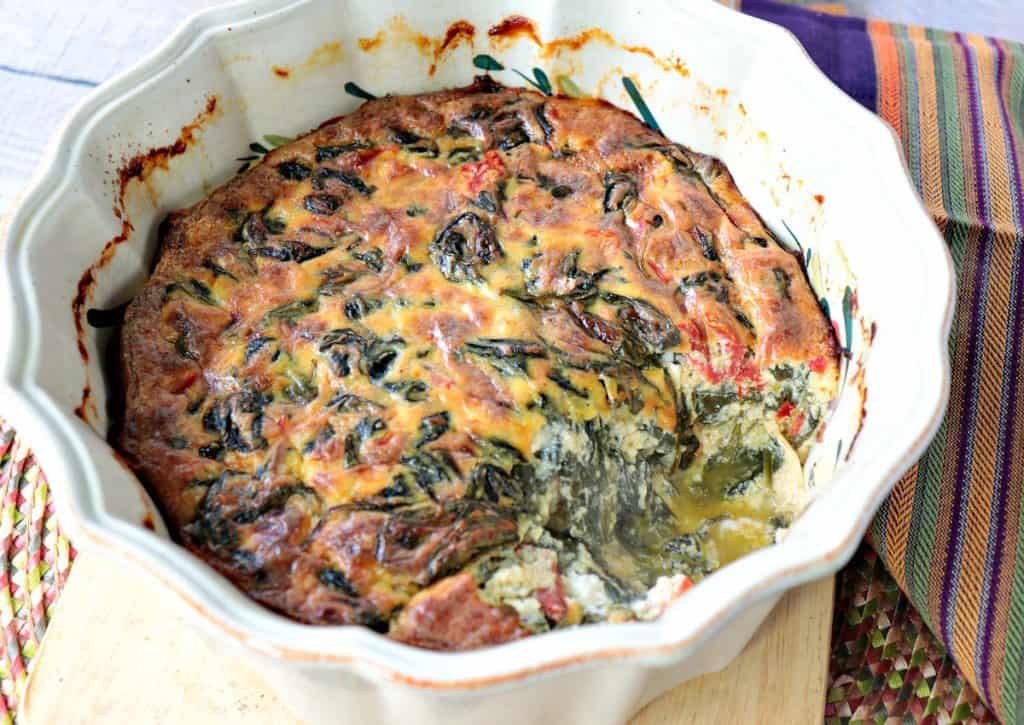 Keto Creamed Spinach Casserole with roasted red pepper and heavy cream. - www.kudoskitchenbyreneecom