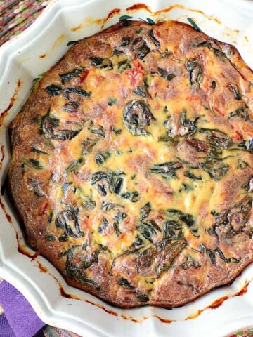 Creamed Spinach Casserole with roasted red pepper and heavy cream. - www.kudoskitchenbyreneecom