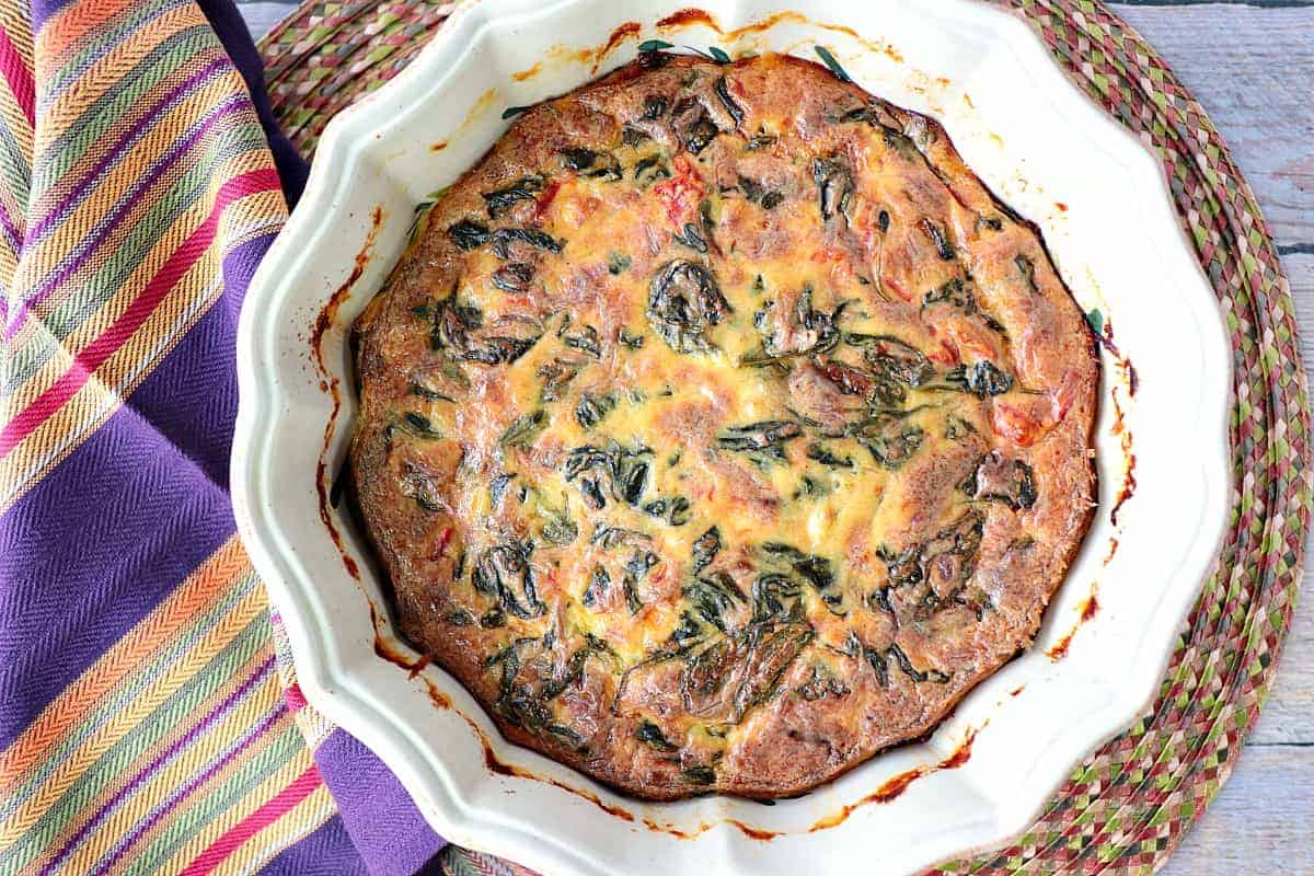 Creamed Spinach Casserole with roasted red pepper and heavy cream. - www.kudoskitchenbyreneecom
