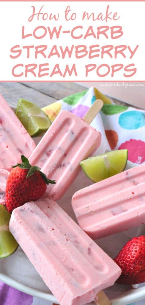 A closeup vertical title text image of frozen whipped cream strawberry keto popsicles on a colorful polka dot napkin with limes and strawberries.