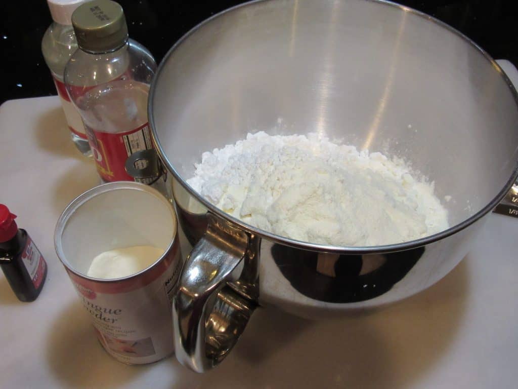 Confectioners sugar in a large mixing bowl ready to be made into royal icing.