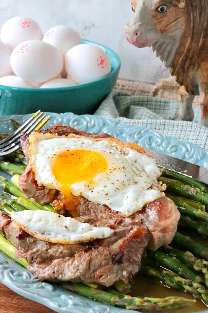 Buttery Rich Steak and Eggs Over Asparagus - www.kudoskitchenbyrenee.com