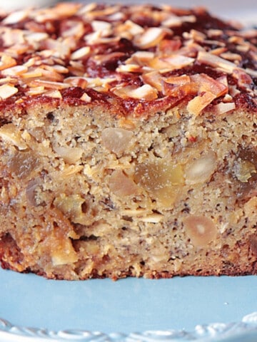 An inside look at an Almond Flour Tropical Banana Bread on a blue plate.