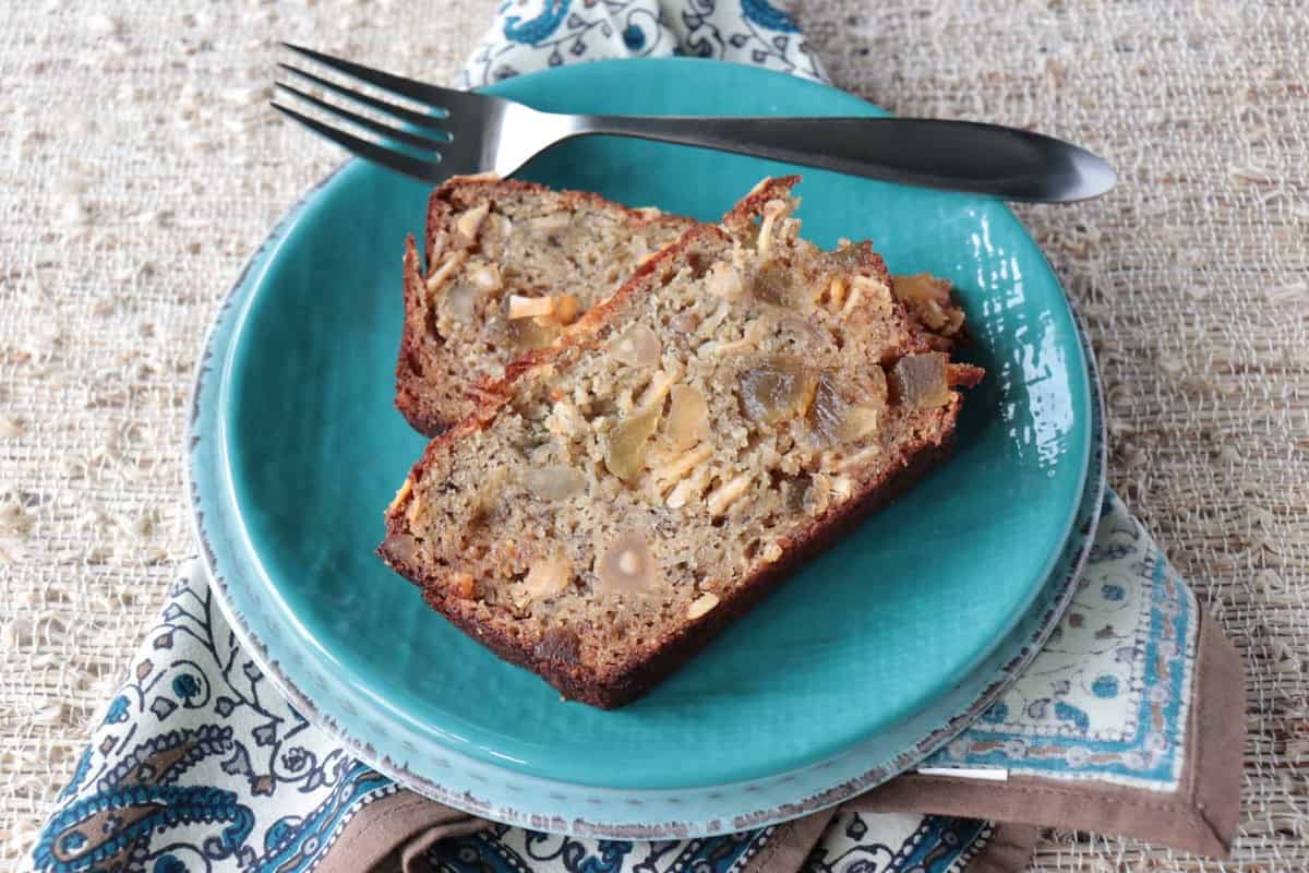 Gluten Free Tropical Banana Bread with Almond Flour, Macadamia Nuts, Pineapple, and Coconut Chips is simply delicious! - kudoskitchenbyrenee.com