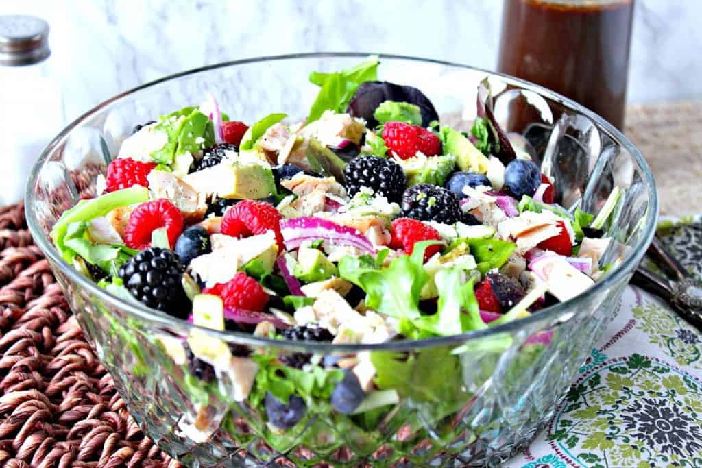 Berry, Chicken and Avocado Salad in a large glass salad bowl.