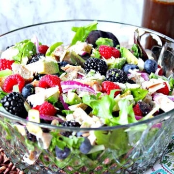 Berry, Chicken and Avocado Salad in a large glass salad bowl.