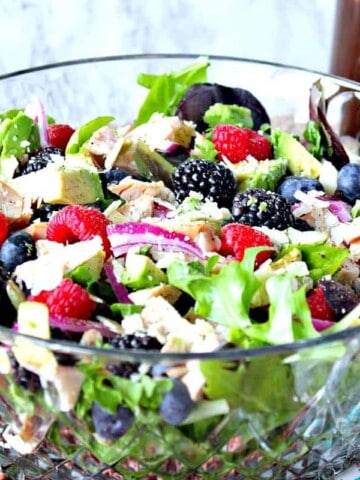 Berry, Chicken and Avocado Salad in a large glass salad bowl.