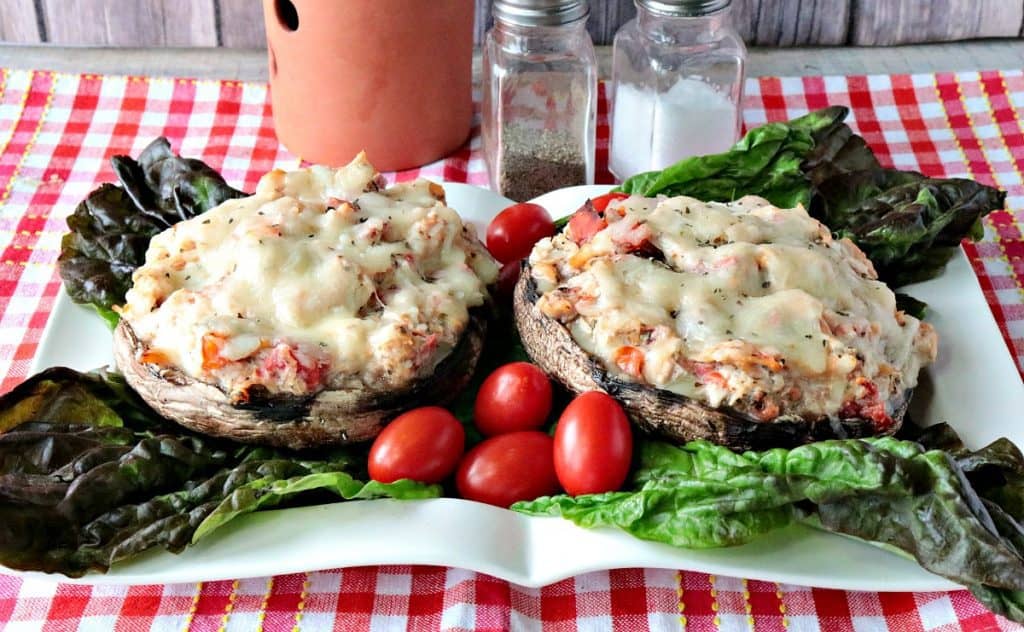 Speedy Chicken Parmesan Portobello Stuffed Mushroom on a plate with lettuce and tomatoes 