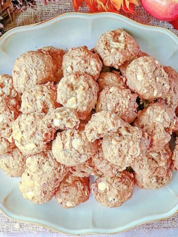 A platter of Apple Oatmeal Cookies with white chocolate and pecans.