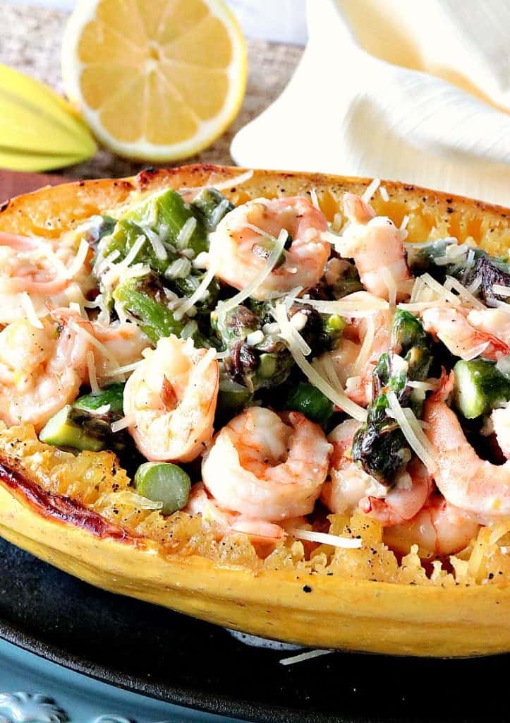 Vertical image of spaghetti squash shrimp scampi with asparagus and Parmesan cheese.