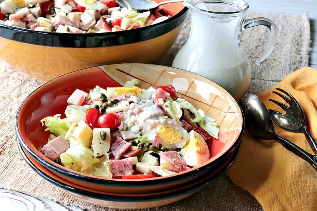 A bowl filled with a homemade Chef's Salad with Blue Cheese Dressing.