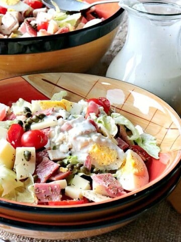 A bowl filled with a homemade Chef's Salad with Blue Cheese Dressing.