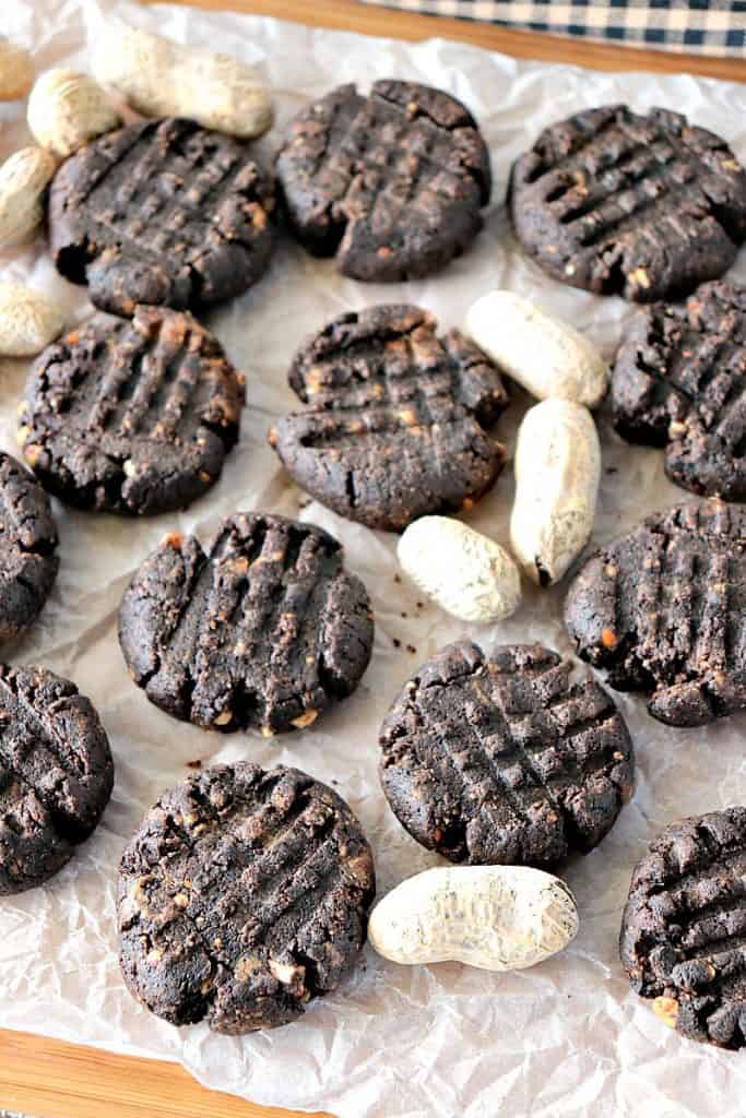 Vertical image of sugar-free chocolate peanut butter cookies with peanuts in the shell 