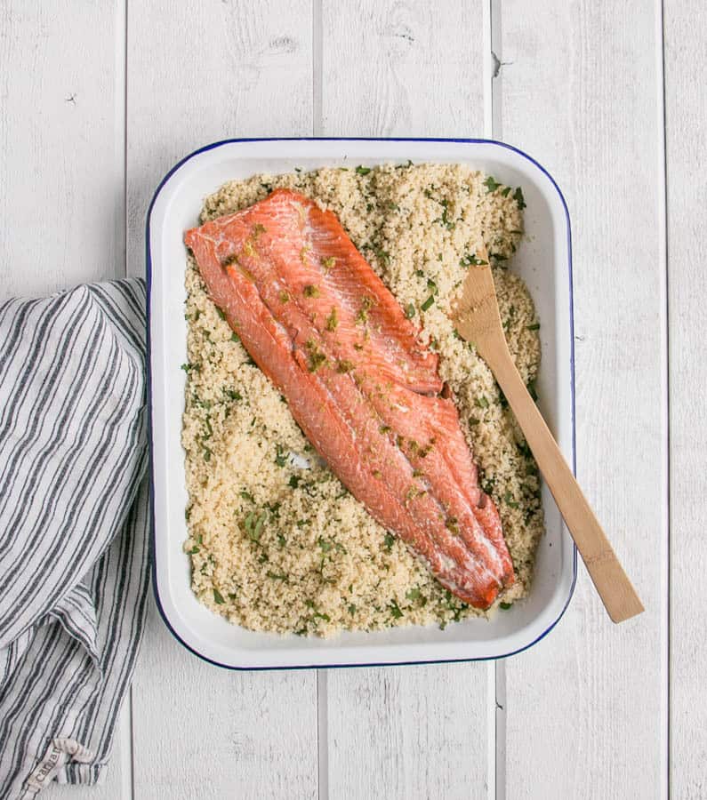Easy Weeknight Dinner Recipes. A salmon fillet in a casserole dish with couscous.